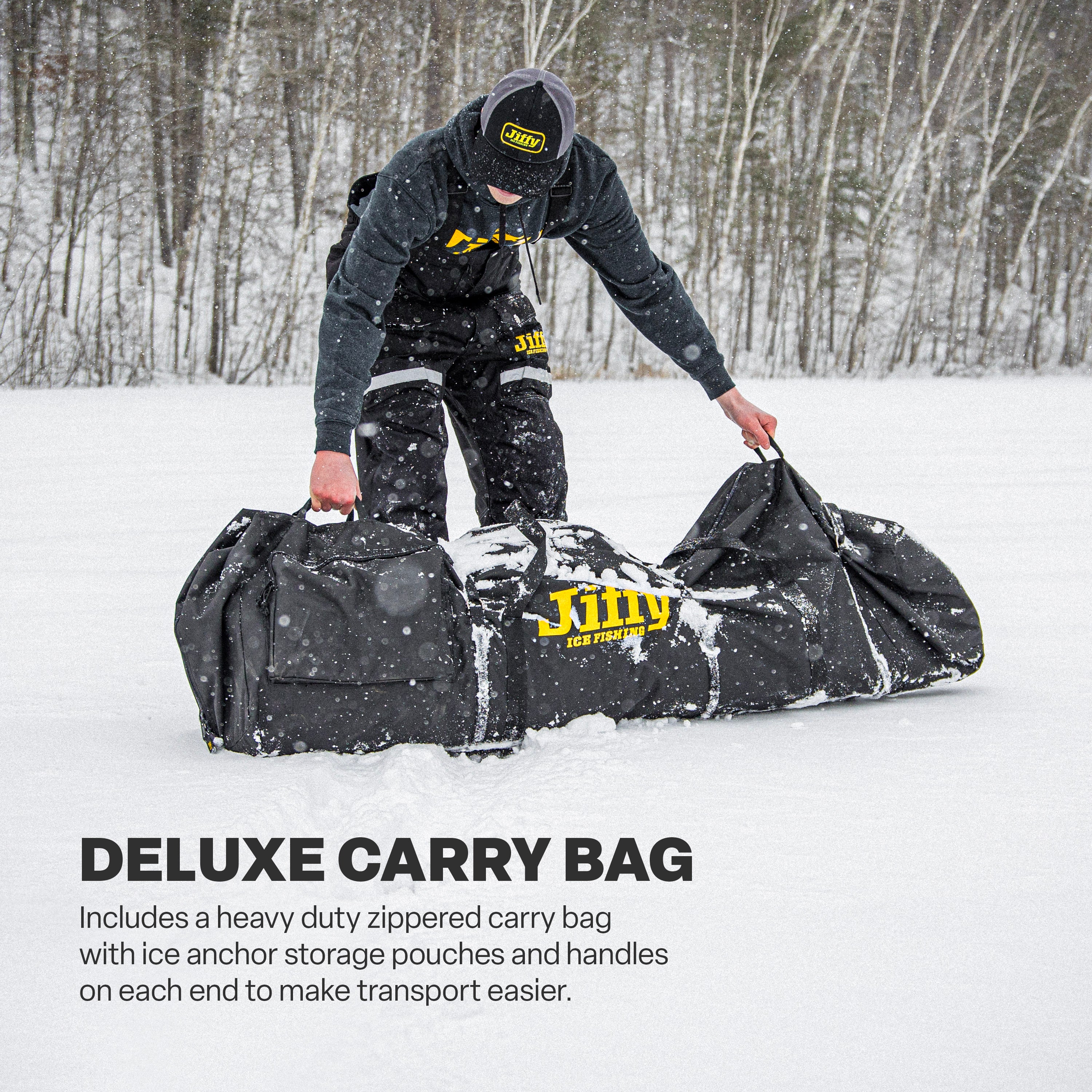Person in snowy landscape with a Basecamp™ shelter in a deluxe carry bag
