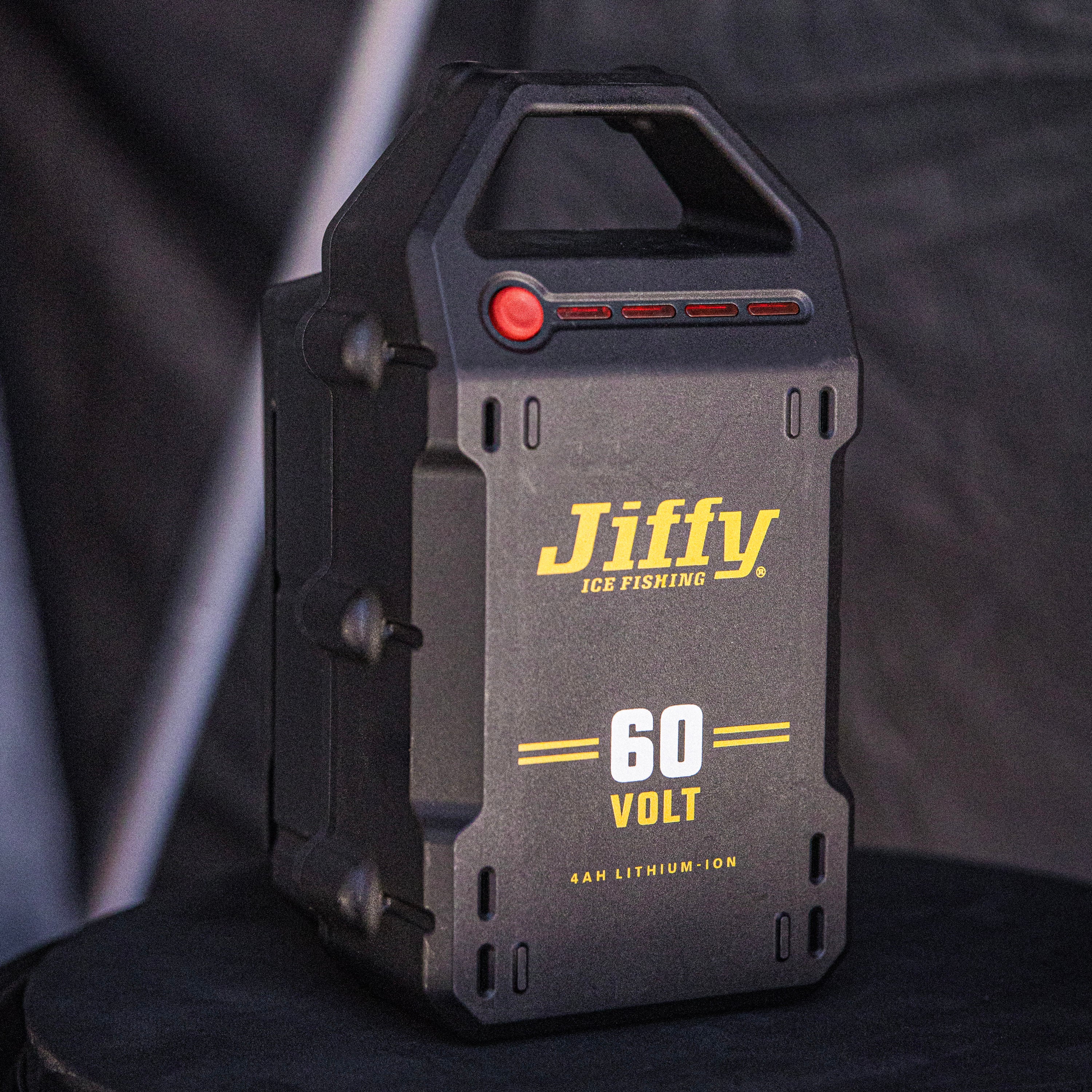 Jiffy ice fishing battery pack with 60 Volt label on a dark background