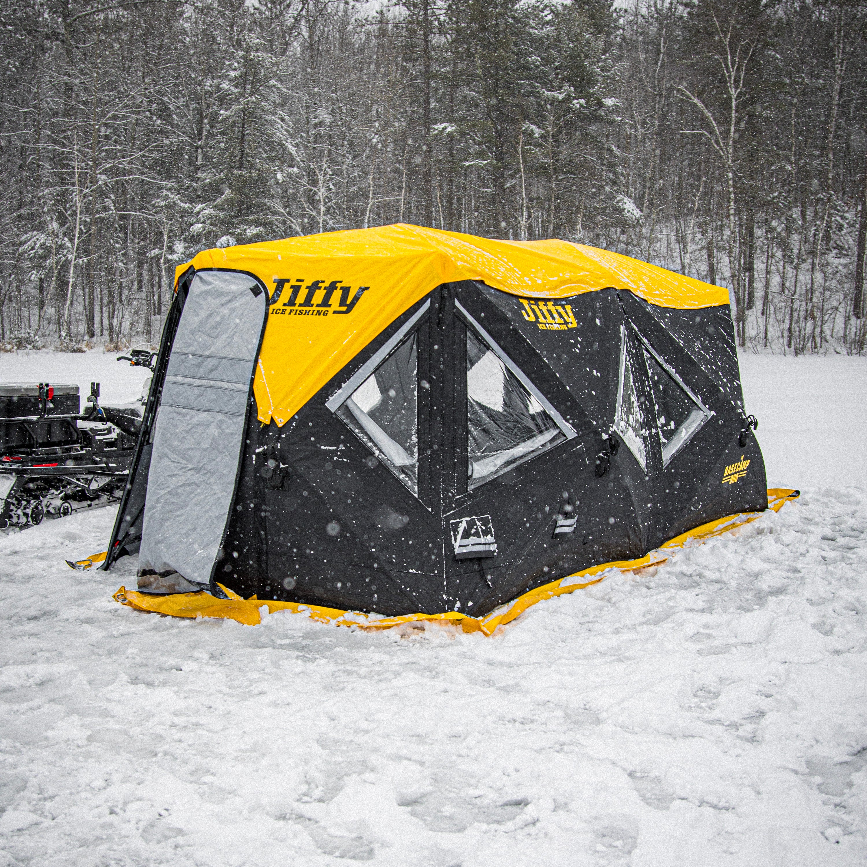 Jiffy Basecamp 980 tent in the snow with a forest background